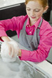 Close-up of a girl washing her hands at a sink
