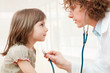 Photo: Female doctor examining child Female doctor examining child