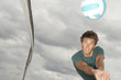 Man playing volleyball on the beach