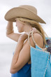 Woman carrying a bag on the beach