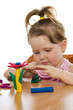 Photo: Cute girl playing with color play plasticine Cute girl playing with color play plasticine