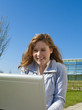 Student with laptop on campus Student with laptop on campus