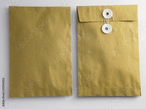 Photo: front and back of brown envelop on the plain background front and back of brown envelop on the plain background