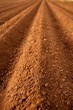 Ploughed red clay soil agriculture fields Ploughed red clay soil agriculture fields