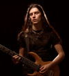man playing electrical guitar