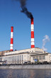 Power plant with the black fume from the red smoke stack