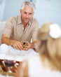Senior man playing backgammon with friend