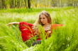beautiful woman lying in green grass beautiful woman lying in green grass