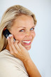 Lovely elderly woman conversing on the cellphone