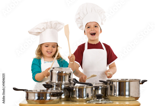 Photo: Happy kids dressed as chefs making noise Happy kids dressed as chefs making noise