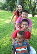 Four children playing in the park.