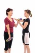 Senior woman exercising with coach
