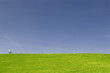 lonely biker against blue sky