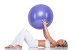 Fitness series - Young woman with purple ball