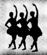 Female ballet dancers against spotlights Female ballet dancers against spotlights