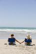 A couple holding hands on the beach