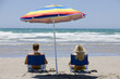A couple relaxing on the beach