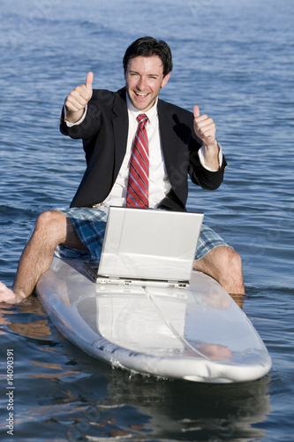 Photo: Businessman on Surfboard Businessman on Surfboard