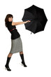 Girl tries to keep black umbrella.