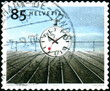 Helvetia. Rails et horloge. timbre postal oblitéré.