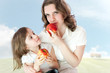 Mom and daughter with apples