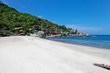 white sand bay with coral reefs