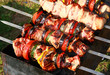 Traditional cooking meat on skewers in the heat of coal Traditional cooking meat on skewers in the heat of coal