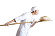 Female baker checking bread, side view, cut out