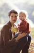 A portrait of a young mother and baby in autumn time