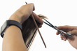 Hairdresser cutting hair, close-up of comb and scissors, cut out