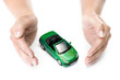 woman hands holding green car isolated on white background