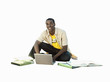 young man sitting on floor working on laptop, cut out