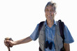 senior man with rucksack holding hiking stick, cut out