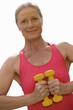 senior woman holding weights, cut out