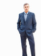 Successful business man standing confidently against white backg