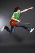 passionate guitarist jumps in the air