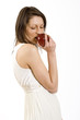 Photo: woman biting a red apple woman biting a red apple