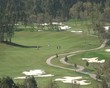 Golfer taking a swing and zooming out to show surroundings