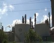Industrial park or estate with smoke, steam and buildings