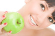 sweet girl eating green apple on white background
