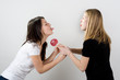 Girls fighting for a lollipop