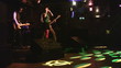 Music group in night club and light spots on floor