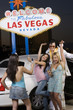 Photo: Young woman photographing two friends with Elvis impersonator, "Welcome to fabulous Las Vegas" sign in background, Las Vegas, Nevada, USA Young woman photographing two friends with Elvis impersonator, "Welcome to fabulous Las Vegas" sign in background, Las Vegas, Nevada, USA