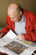 Senior man reading newspaper