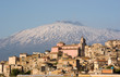 view of village and belltower on background Etna view of village and belltower on background Etna