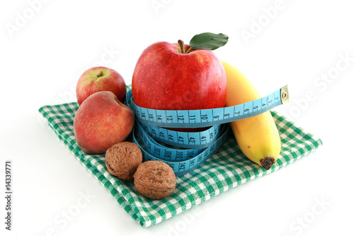 Photo: On diet - fresh fruits and tape measure On diet - fresh fruits and tape measure
