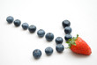 Arrow formation made of of strawberry and blueberry