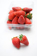Strawberries with container, fresh