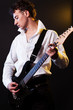 guitarist in white shirt