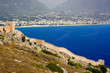Turkey, a stone wall with a kind on the sea and city